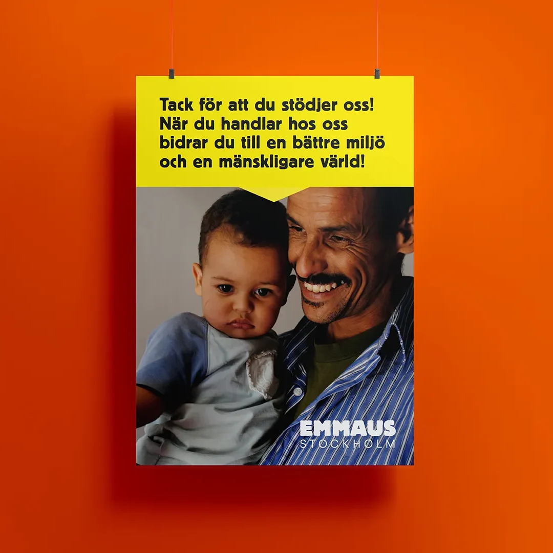 Retail poster for Artikel 2 showing a smiling person holding a small child
